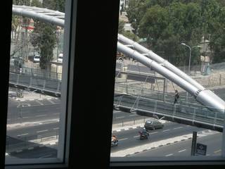 Woman Crosses Pedestrian Bridge