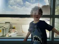Eden at the airport tarmac window