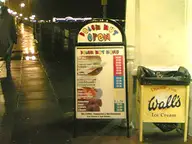 Woman and Donuts Near Pier