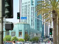 Man crossing Wilshire at Serrano
