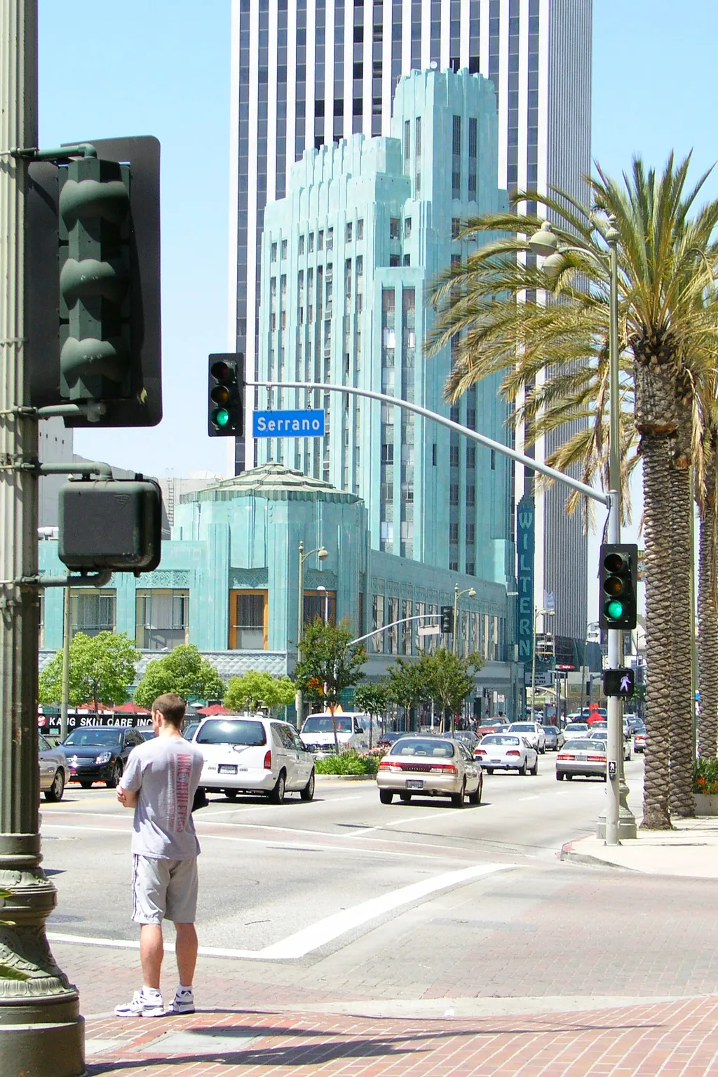 Man crossing Wilshire at Serrano